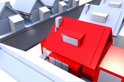 red_house_surrounded_by_grey_houses